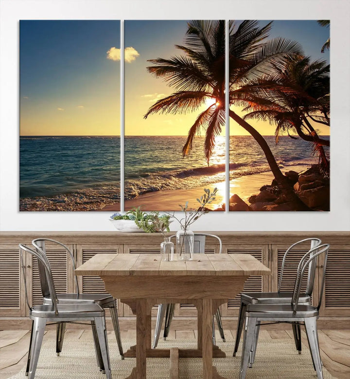 The Sunset Palm Trees Wall Art Canvas Print, a triptych masterpiece depicting a tropical beach sunset with palm trees, is expertly displayed on museum-quality canvases.