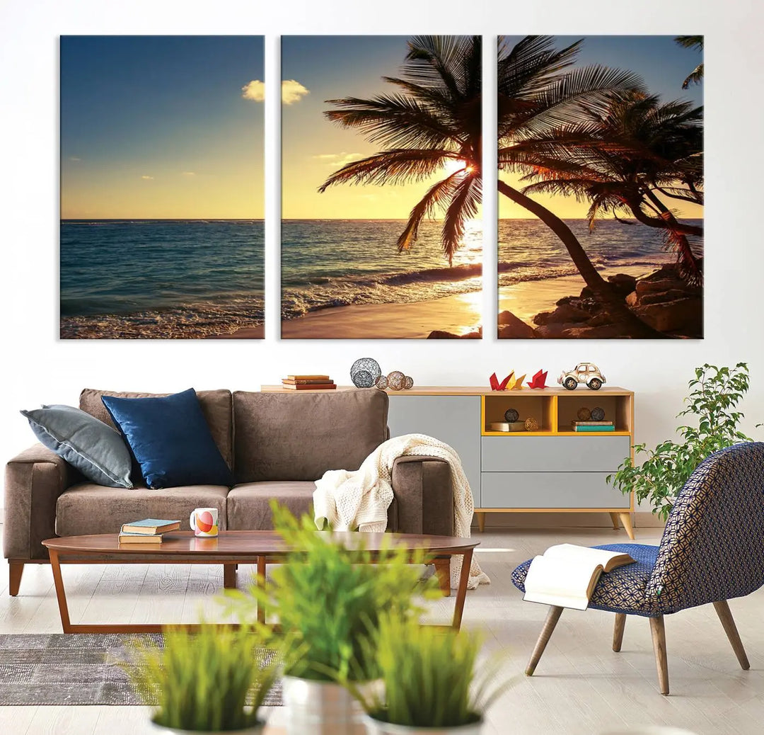 The Sunset Palm Trees Wall Art Canvas Print, a triptych masterpiece depicting a tropical beach sunset with palm trees, is expertly displayed on museum-quality canvases.