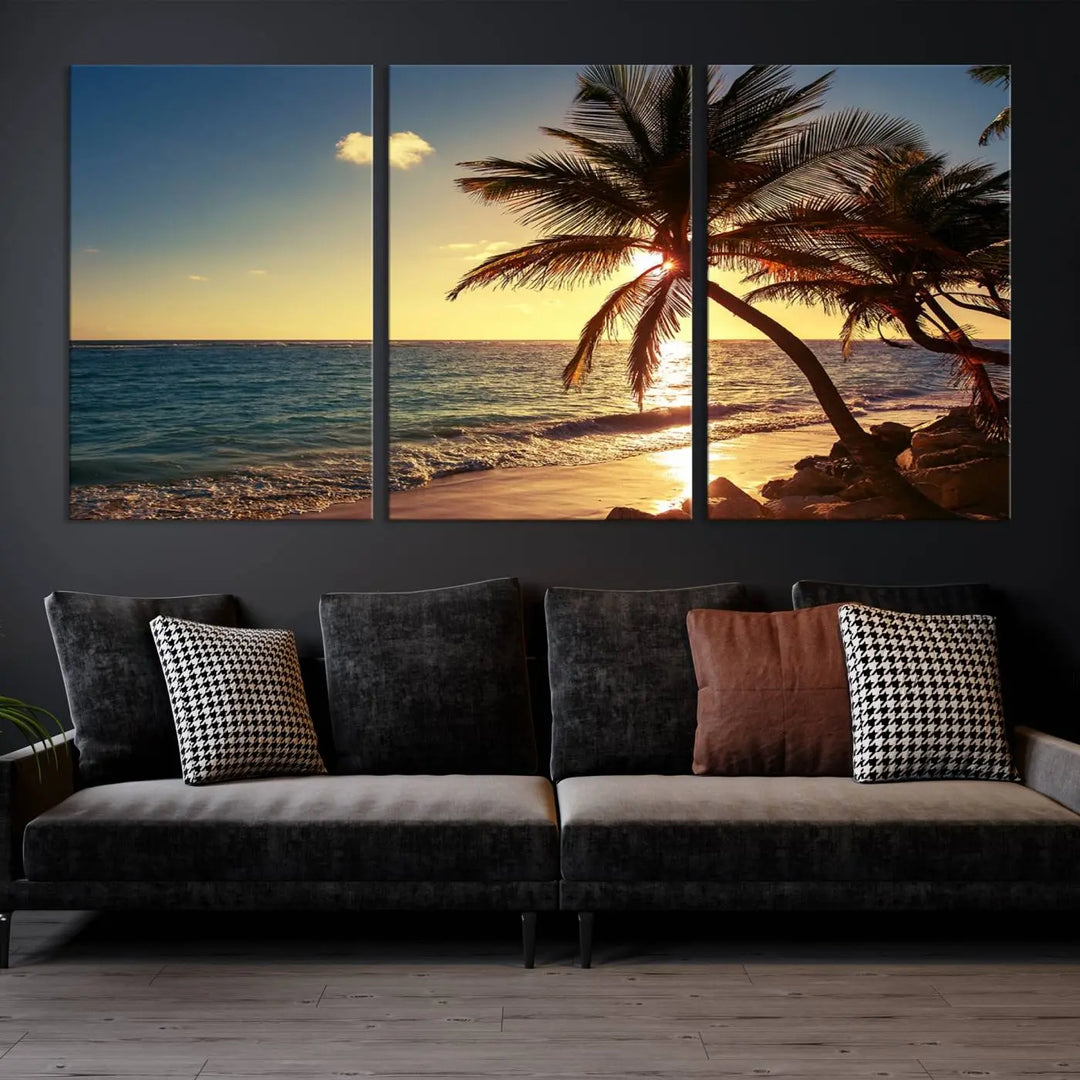 The Sunset Palm Trees Wall Art Canvas Print, a triptych masterpiece depicting a tropical beach sunset with palm trees, is expertly displayed on museum-quality canvases.