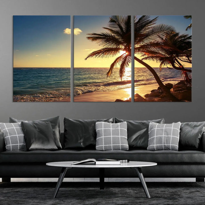 The Sunset Palm Trees Wall Art Canvas Print, a triptych masterpiece depicting a tropical beach sunset with palm trees, is expertly displayed on museum-quality canvases.