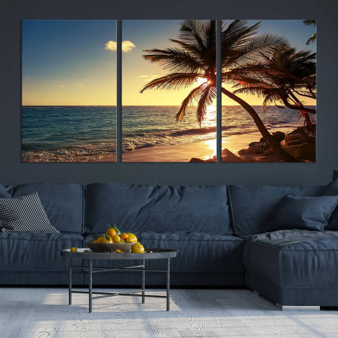 The Sunset Palm Trees Wall Art Canvas Print, a triptych masterpiece depicting a tropical beach sunset with palm trees, is expertly displayed on museum-quality canvases.