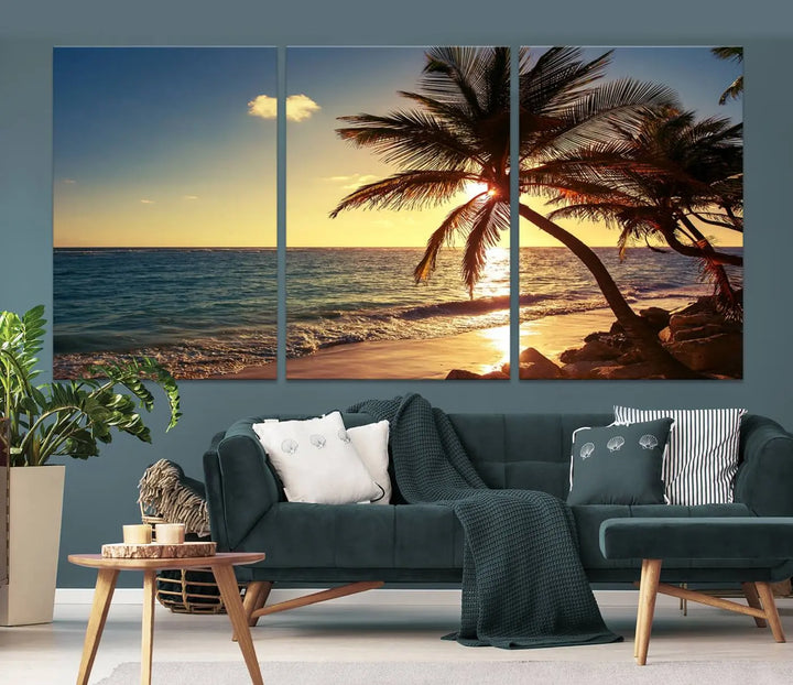 The Sunset Palm Trees Wall Art Canvas Print, a triptych masterpiece depicting a tropical beach sunset with palm trees, is expertly displayed on museum-quality canvases.