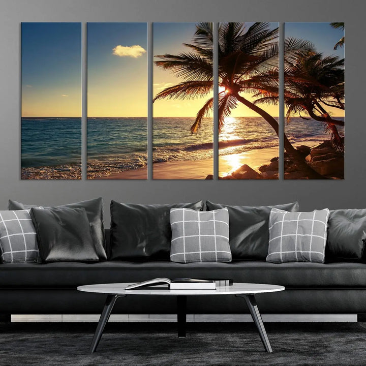 The Sunset Palm Trees Wall Art Canvas Print, a triptych masterpiece depicting a tropical beach sunset with palm trees, is expertly displayed on museum-quality canvases.