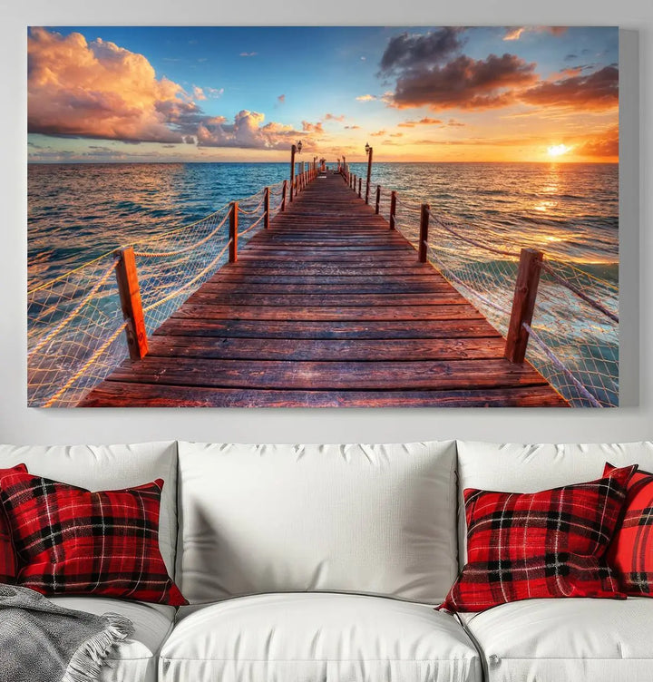 The Sunset Pier Canvas Wall Art is a triptych featuring an ocean landscape that elegantly captures a tranquil beach sunset with gentle ocean waves. It comes beautifully framed and ready to hang.