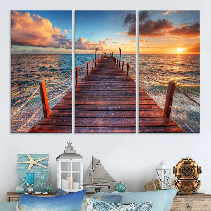 The Sunset Pier Canvas Wall Art is a triptych featuring an ocean landscape that elegantly captures a tranquil beach sunset with gentle ocean waves. It comes beautifully framed and ready to hang.