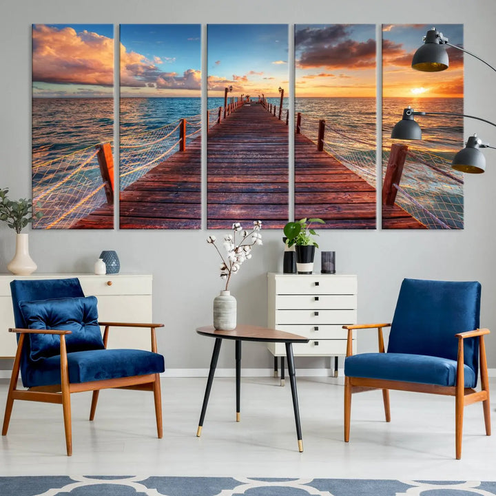 The Sunset Pier Canvas Wall Art is a triptych featuring an ocean landscape that elegantly captures a tranquil beach sunset with gentle ocean waves. It comes beautifully framed and ready to hang.