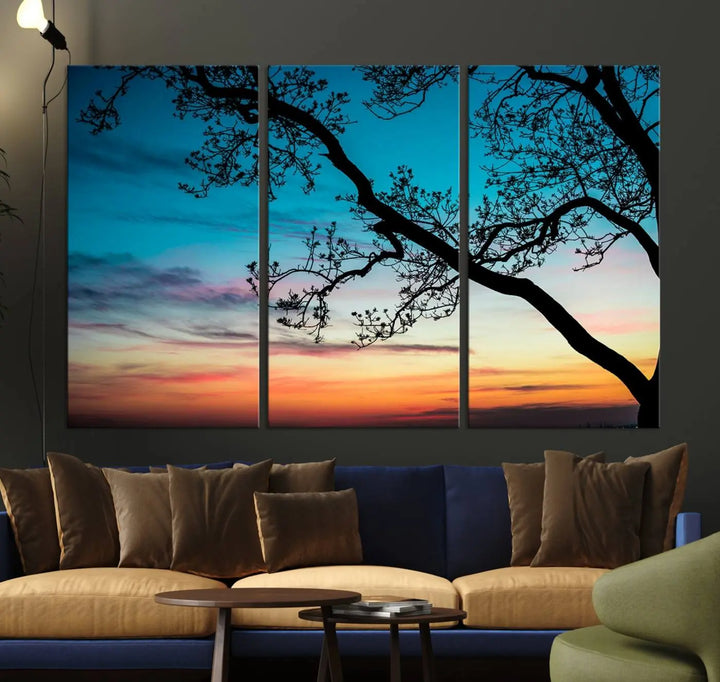 The "Sunset Tree Leaves Wall Art Canvas Print" features a triptych of tree branches against a vibrant sunset sky. Each piece is printed on museum-quality canvas and finished with a UV-protective coating, ensuring it is both stunning and ready to hang.