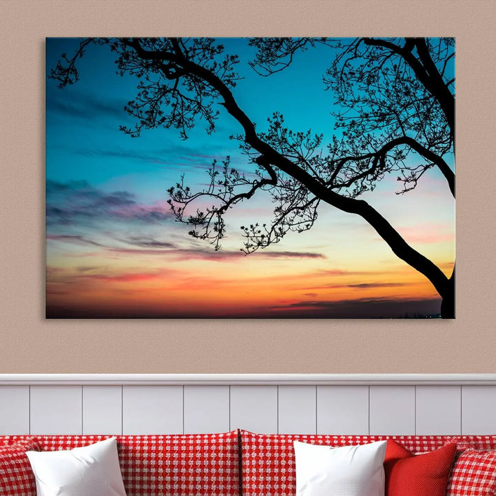 The "Sunset Tree Leaves Wall Art Canvas Print" features a triptych of tree branches against a vibrant sunset sky. Each piece is printed on museum-quality canvas and finished with a UV-protective coating, ensuring it is both stunning and ready to hang.