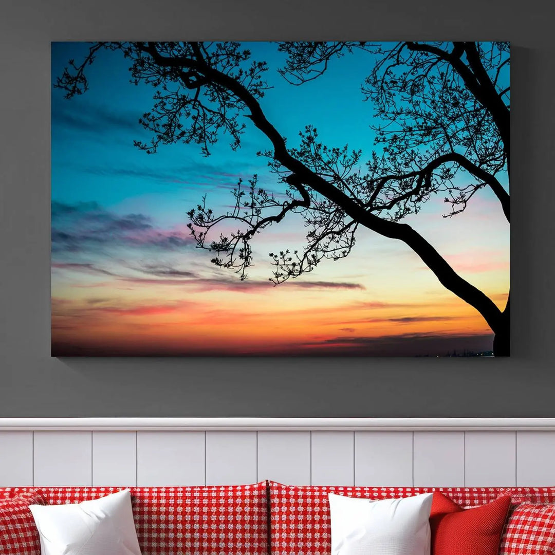 The "Sunset Tree Leaves Wall Art Canvas Print" features a triptych of tree branches against a vibrant sunset sky. Each piece is printed on museum-quality canvas and finished with a UV-protective coating, ensuring it is both stunning and ready to hang.