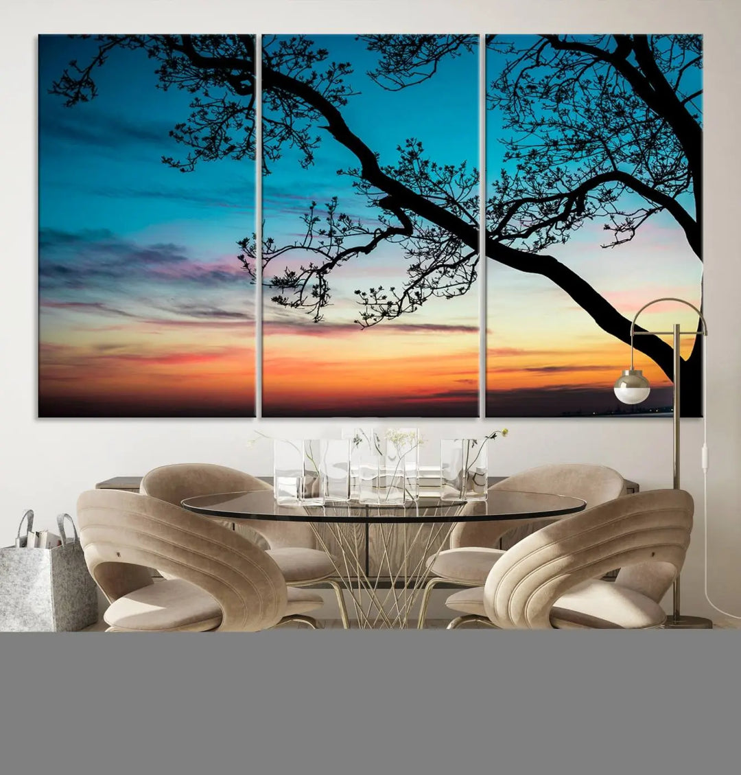 The "Sunset Tree Leaves Wall Art Canvas Print" features a triptych of tree branches against a vibrant sunset sky. Each piece is printed on museum-quality canvas and finished with a UV-protective coating, ensuring it is both stunning and ready to hang.