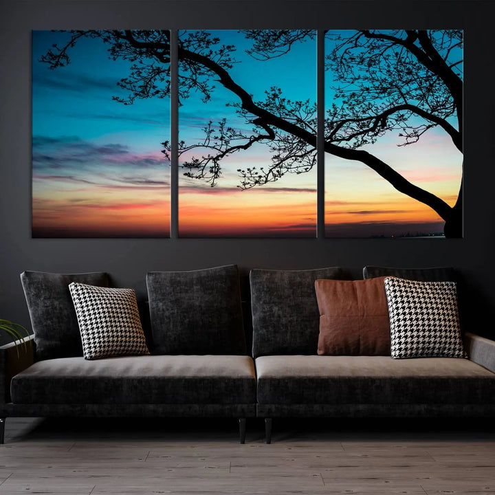 The "Sunset Tree Leaves Wall Art Canvas Print" features a triptych of tree branches against a vibrant sunset sky. Each piece is printed on museum-quality canvas and finished with a UV-protective coating, ensuring it is both stunning and ready to hang.