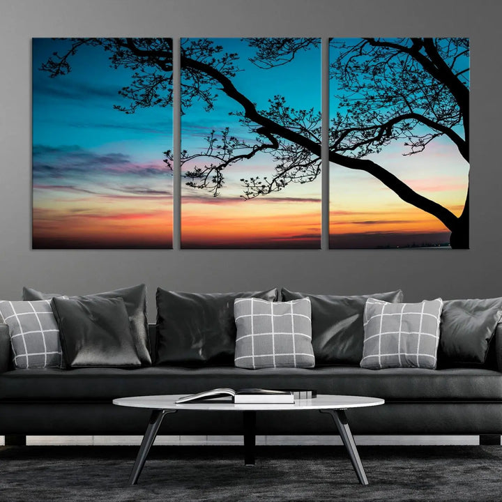 The "Sunset Tree Leaves Wall Art Canvas Print" features a triptych of tree branches against a vibrant sunset sky. Each piece is printed on museum-quality canvas and finished with a UV-protective coating, ensuring it is both stunning and ready to hang.