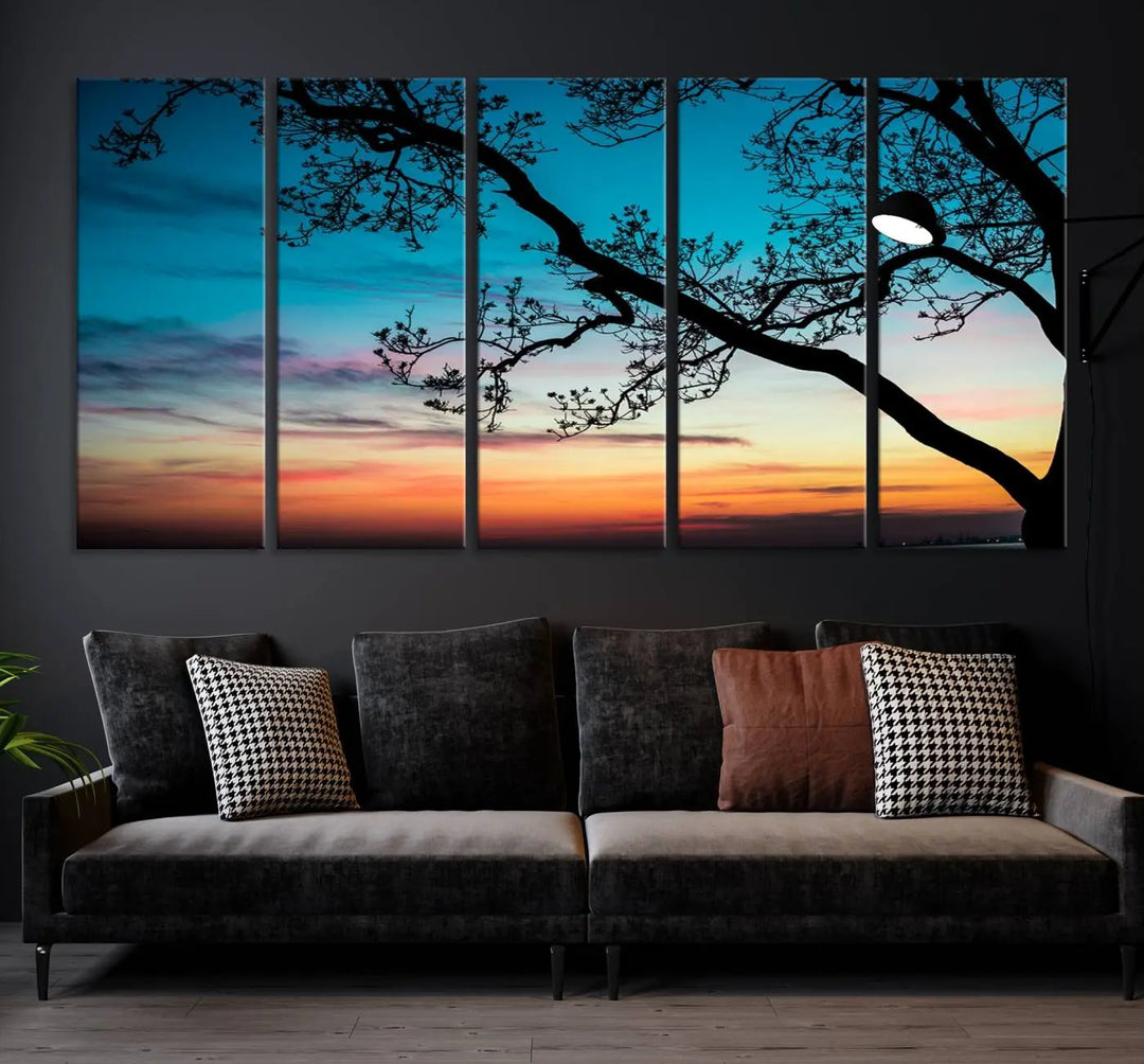 The "Sunset Tree Leaves Wall Art Canvas Print" features a triptych of tree branches against a vibrant sunset sky. Each piece is printed on museum-quality canvas and finished with a UV-protective coating, ensuring it is both stunning and ready to hang.