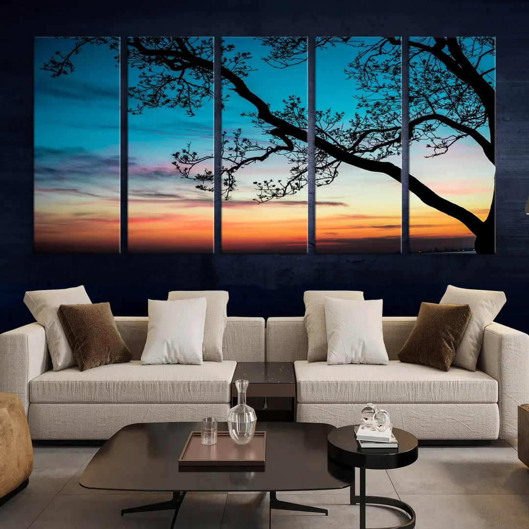 The "Sunset Tree Leaves Wall Art Canvas Print" features a triptych of tree branches against a vibrant sunset sky. Each piece is printed on museum-quality canvas and finished with a UV-protective coating, ensuring it is both stunning and ready to hang.