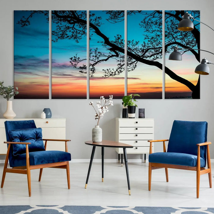 The "Sunset Tree Leaves Wall Art Canvas Print" features a triptych of tree branches against a vibrant sunset sky. Each piece is printed on museum-quality canvas and finished with a UV-protective coating, ensuring it is both stunning and ready to hang.