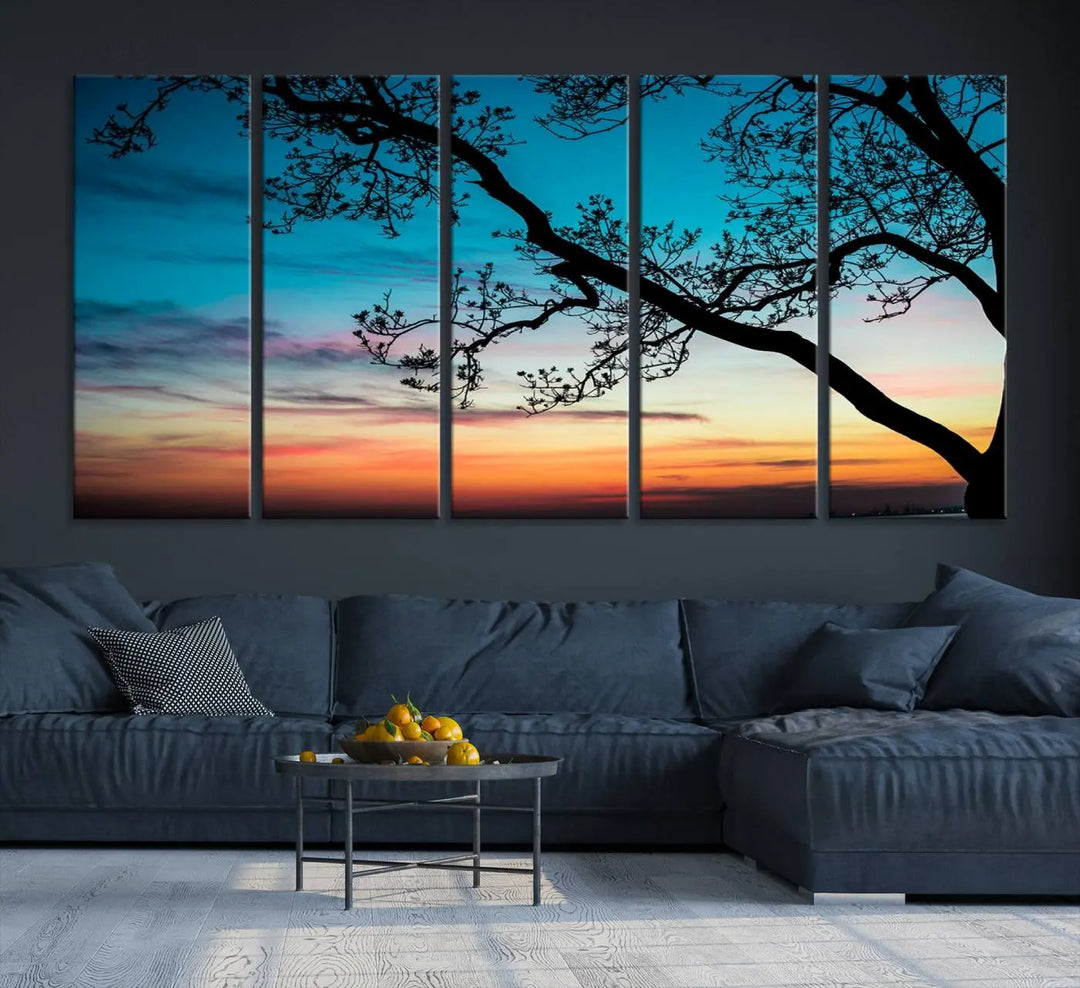 The "Sunset Tree Leaves Wall Art Canvas Print" features a triptych of tree branches against a vibrant sunset sky. Each piece is printed on museum-quality canvas and finished with a UV-protective coating, ensuring it is both stunning and ready to hang.