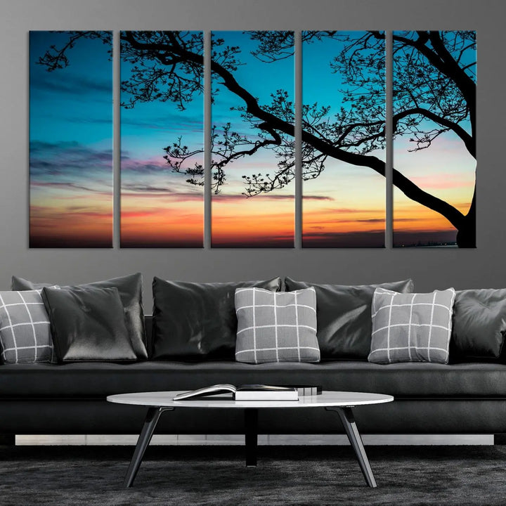 The "Sunset Tree Leaves Wall Art Canvas Print" features a triptych of tree branches against a vibrant sunset sky. Each piece is printed on museum-quality canvas and finished with a UV-protective coating, ensuring it is both stunning and ready to hang.