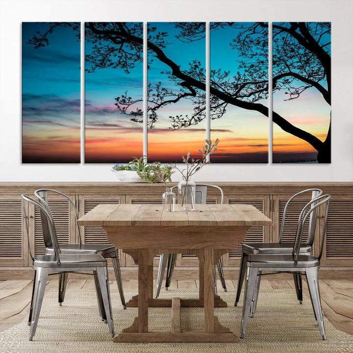 The "Sunset Tree Leaves Wall Art Canvas Print" features a triptych of tree branches against a vibrant sunset sky. Each piece is printed on museum-quality canvas and finished with a UV-protective coating, ensuring it is both stunning and ready to hang.