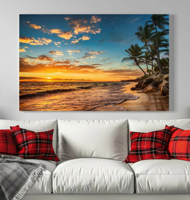 The Sunset Wall Art Canvas Print beautifully enhances the living room. This tropical triptych, crafted on museum-quality canvas, depicts a sunset with palm trees and adds a touch of paradise to the space. Enjoy the charm of hand-assembled frames with free shipping included.