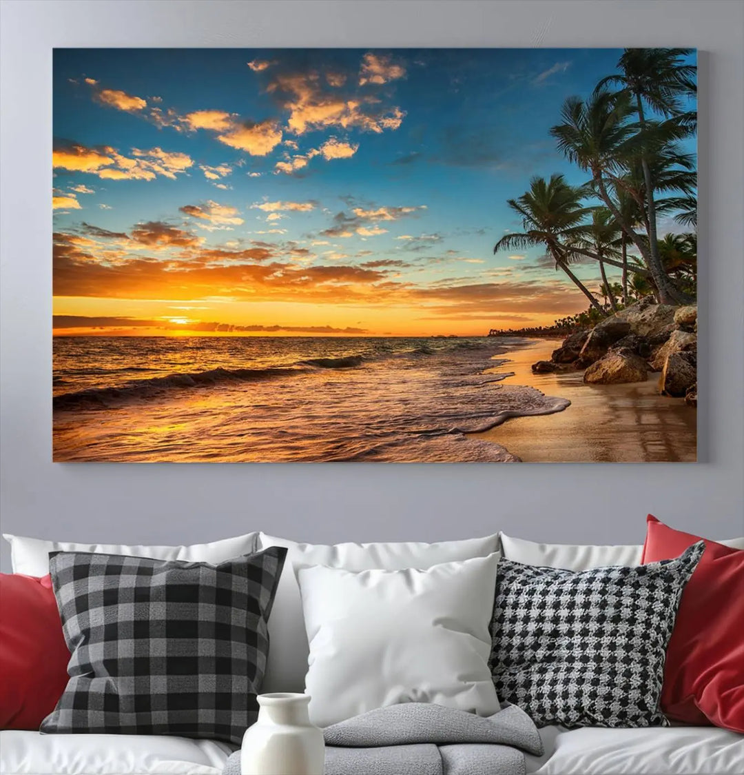 The Sunset Wall Art Canvas Print beautifully enhances the living room. This tropical triptych, crafted on museum-quality canvas, depicts a sunset with palm trees and adds a touch of paradise to the space. Enjoy the charm of hand-assembled frames with free shipping included.