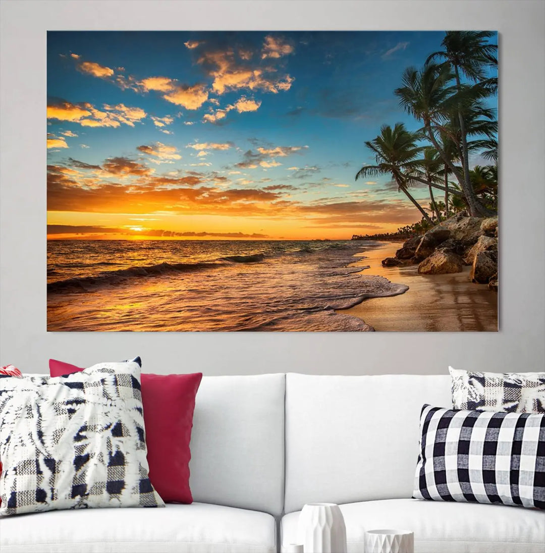 The Sunset Wall Art Canvas Print beautifully enhances the living room. This tropical triptych, crafted on museum-quality canvas, depicts a sunset with palm trees and adds a touch of paradise to the space. Enjoy the charm of hand-assembled frames with free shipping included.