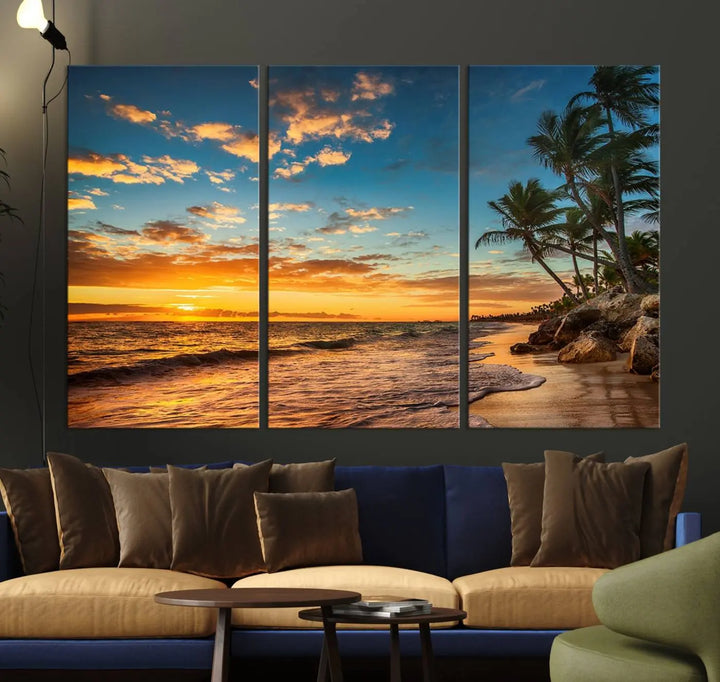 The Sunset Wall Art Canvas Print beautifully enhances the living room. This tropical triptych, crafted on museum-quality canvas, depicts a sunset with palm trees and adds a touch of paradise to the space. Enjoy the charm of hand-assembled frames with free shipping included.