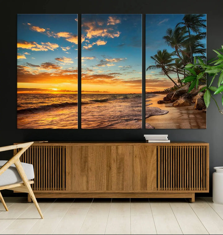 The Sunset Wall Art Canvas Print beautifully enhances the living room. This tropical triptych, crafted on museum-quality canvas, depicts a sunset with palm trees and adds a touch of paradise to the space. Enjoy the charm of hand-assembled frames with free shipping included.