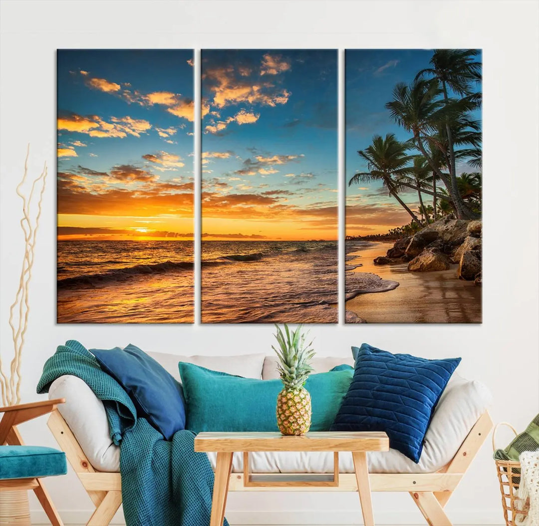 The Sunset Wall Art Canvas Print beautifully enhances the living room. This tropical triptych, crafted on museum-quality canvas, depicts a sunset with palm trees and adds a touch of paradise to the space. Enjoy the charm of hand-assembled frames with free shipping included.