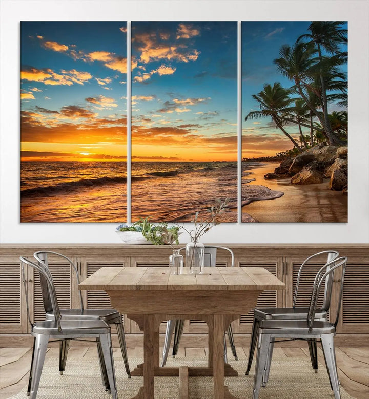 The Sunset Wall Art Canvas Print beautifully enhances the living room. This tropical triptych, crafted on museum-quality canvas, depicts a sunset with palm trees and adds a touch of paradise to the space. Enjoy the charm of hand-assembled frames with free shipping included.