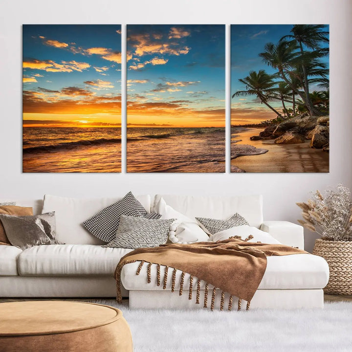 The Sunset Wall Art Canvas Print beautifully enhances the living room. This tropical triptych, crafted on museum-quality canvas, depicts a sunset with palm trees and adds a touch of paradise to the space. Enjoy the charm of hand-assembled frames with free shipping included.