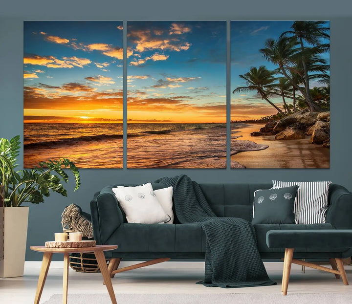 The Sunset Wall Art Canvas Print beautifully enhances the living room. This tropical triptych, crafted on museum-quality canvas, depicts a sunset with palm trees and adds a touch of paradise to the space. Enjoy the charm of hand-assembled frames with free shipping included.