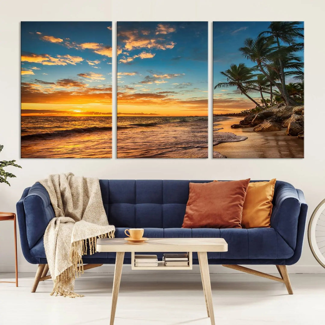 The Sunset Wall Art Canvas Print beautifully enhances the living room. This tropical triptych, crafted on museum-quality canvas, depicts a sunset with palm trees and adds a touch of paradise to the space. Enjoy the charm of hand-assembled frames with free shipping included.