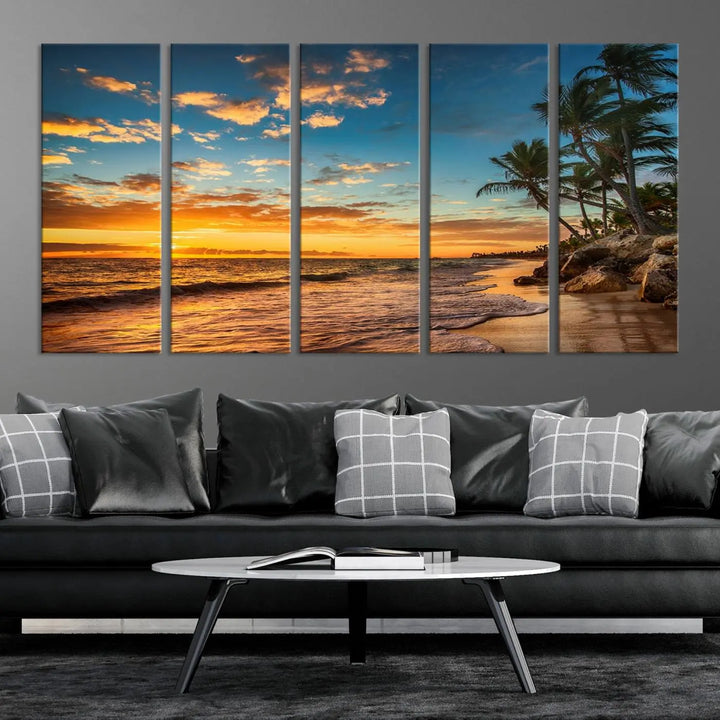 The Sunset Wall Art Canvas Print beautifully enhances the living room. This tropical triptych, crafted on museum-quality canvas, depicts a sunset with palm trees and adds a touch of paradise to the space. Enjoy the charm of hand-assembled frames with free shipping included.