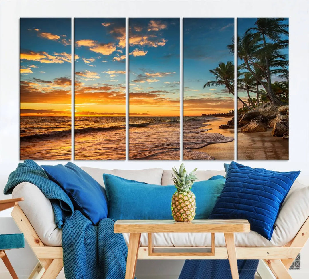 The Sunset Wall Art Canvas Print beautifully enhances the living room. This tropical triptych, crafted on museum-quality canvas, depicts a sunset with palm trees and adds a touch of paradise to the space. Enjoy the charm of hand-assembled frames with free shipping included.