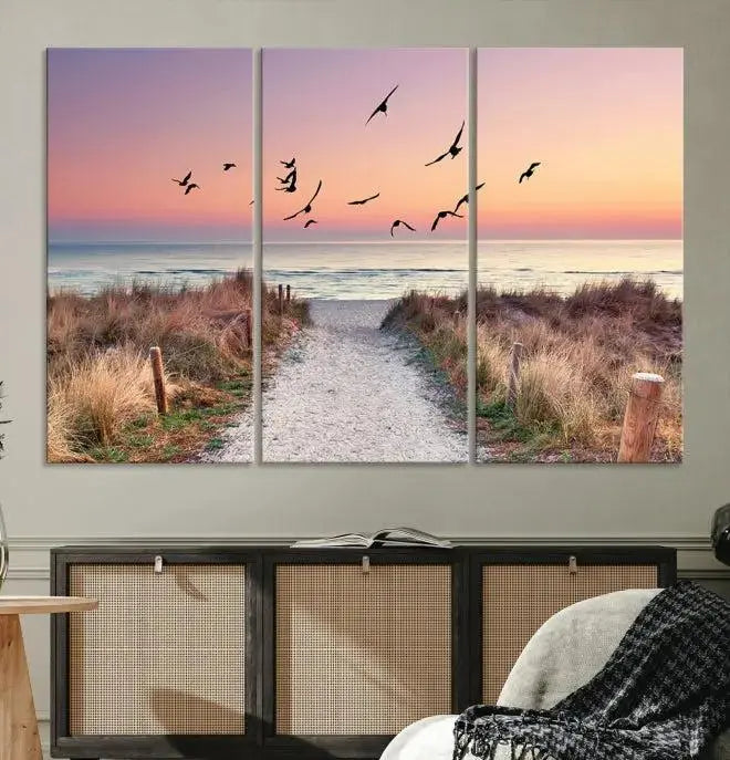 The wall art, titled "Sunset and Ocean Wall Art Canvas Print," is a museum-quality piece depicting a beach path at sunset with birds in flight.