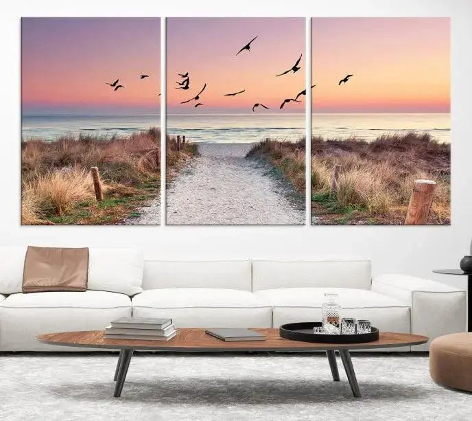 The wall art, titled "Sunset and Ocean Wall Art Canvas Print," is a museum-quality piece depicting a beach path at sunset with birds in flight.