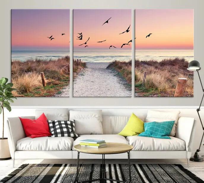 The wall art, titled "Sunset and Ocean Wall Art Canvas Print," is a museum-quality piece depicting a beach path at sunset with birds in flight.