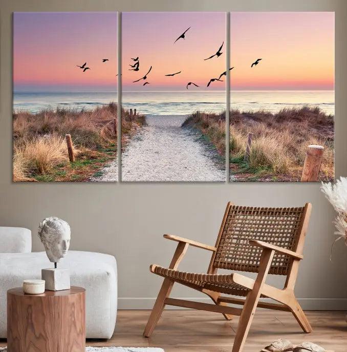 The wall art, titled "Sunset and Ocean Wall Art Canvas Print," is a museum-quality piece depicting a beach path at sunset with birds in flight.