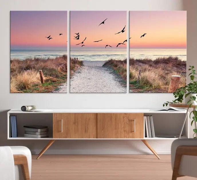 The wall art, titled "Sunset and Ocean Wall Art Canvas Print," is a museum-quality piece depicting a beach path at sunset with birds in flight.