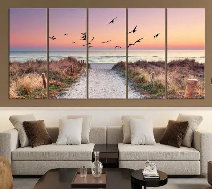 The wall art, titled "Sunset and Ocean Wall Art Canvas Print," is a museum-quality piece depicting a beach path at sunset with birds in flight.