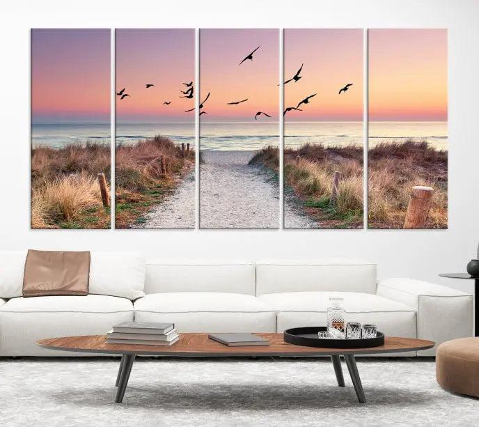 The wall art, titled "Sunset and Ocean Wall Art Canvas Print," is a museum-quality piece depicting a beach path at sunset with birds in flight.