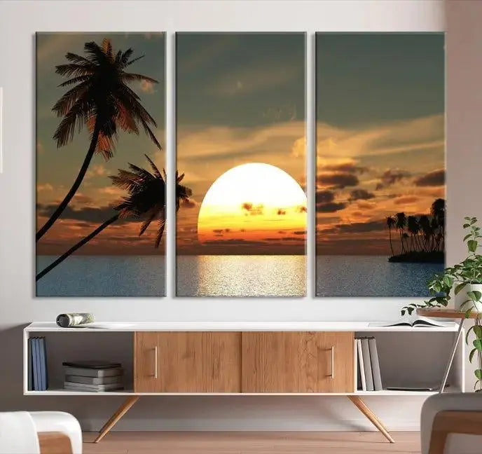 The Sunset and Palms Wall Art Canvas Print features a triptych design showcasing a tropical sunset over the ocean with silhouetted palm trees. These museum-quality canvases, adorned with UV-protective coating to maintain their vibrant appearance, are ready to enhance any room.