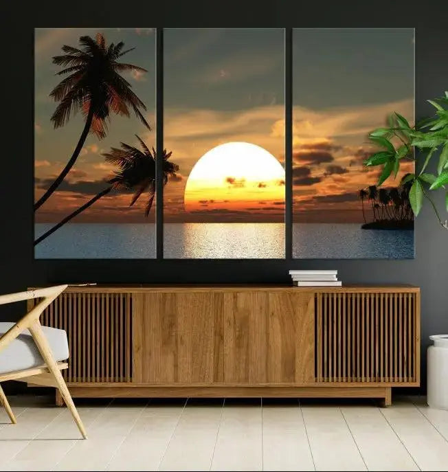 The Sunset and Palms Wall Art Canvas Print features a triptych design showcasing a tropical sunset over the ocean with silhouetted palm trees. These museum-quality canvases, adorned with UV-protective coating to maintain their vibrant appearance, are ready to enhance any room.