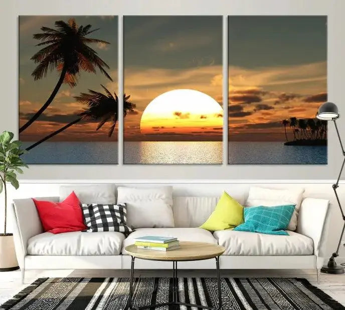 The Sunset and Palms Wall Art Canvas Print features a triptych design showcasing a tropical sunset over the ocean with silhouetted palm trees. These museum-quality canvases, adorned with UV-protective coating to maintain their vibrant appearance, are ready to enhance any room.