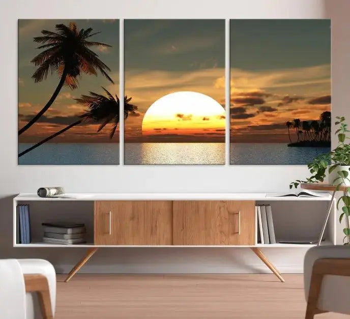 The Sunset and Palms Wall Art Canvas Print features a triptych design showcasing a tropical sunset over the ocean with silhouetted palm trees. These museum-quality canvases, adorned with UV-protective coating to maintain their vibrant appearance, are ready to enhance any room.