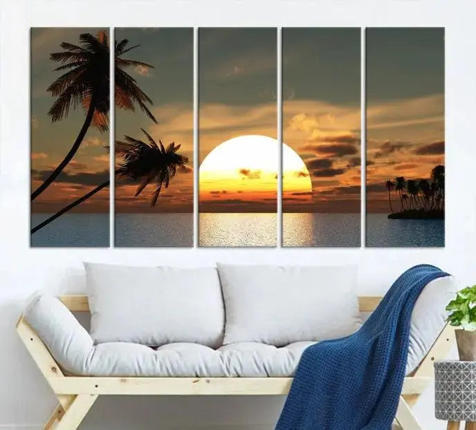 The Sunset and Palms Wall Art Canvas Print features a triptych design showcasing a tropical sunset over the ocean with silhouetted palm trees. These museum-quality canvases, adorned with UV-protective coating to maintain their vibrant appearance, are ready to enhance any room.