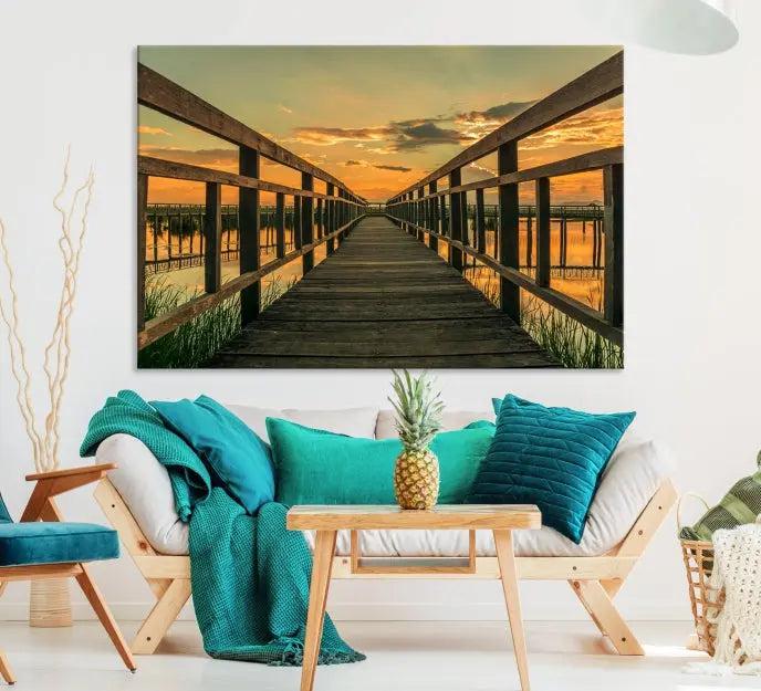 The "Sunset and Wood Bridge" triptych, printed on museum-quality canvases with a UV-protective coating, adorns the wall.