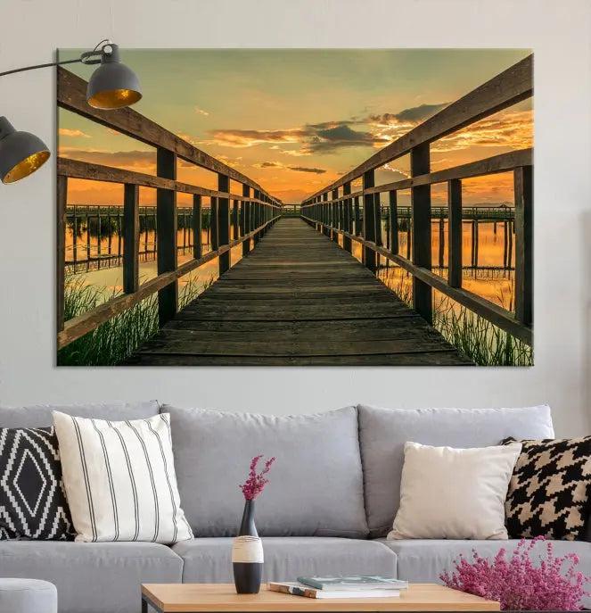 The "Sunset and Wood Bridge" triptych, printed on museum-quality canvases with a UV-protective coating, adorns the wall.