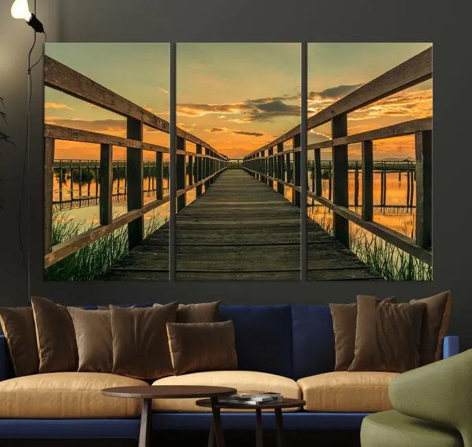 The "Sunset and Wood Bridge" triptych, printed on museum-quality canvases with a UV-protective coating, adorns the wall.