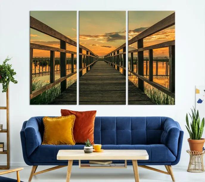 The "Sunset and Wood Bridge" triptych, printed on museum-quality canvases with a UV-protective coating, adorns the wall.